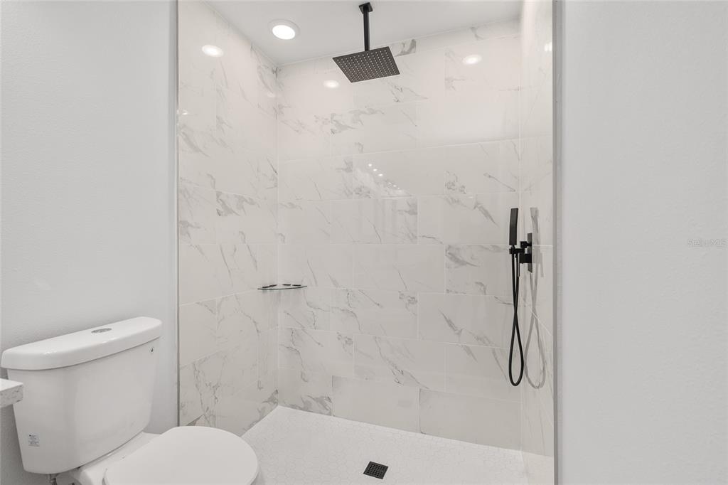 15769 Southwest 14th Street Ocala, FL 34481 - Photo 29 of 46 a bathroom with a toilet and a shower