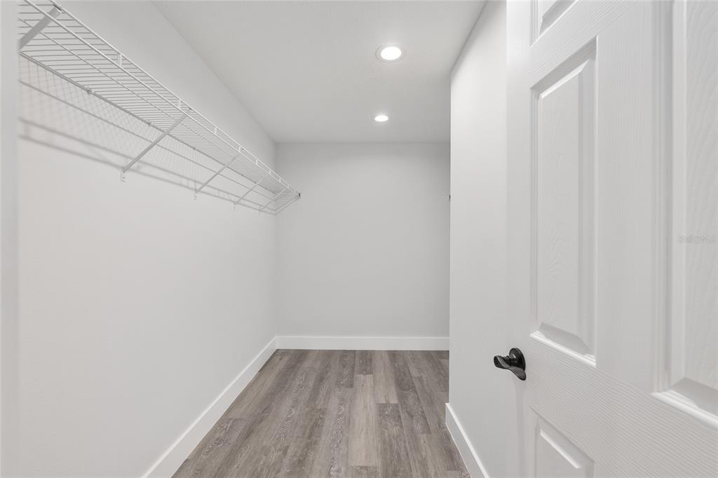 15769 Southwest 14th Street Ocala, FL 34481 - Photo 31 of 46 a view of a room with wooden floor and bench