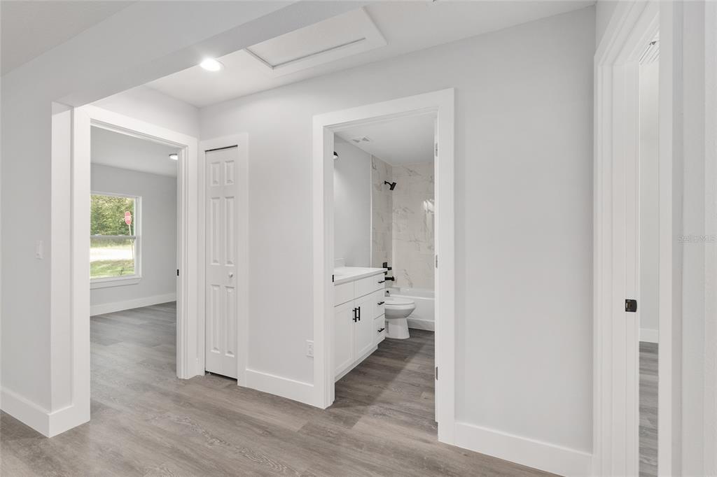 15769 Southwest 14th Street Ocala, FL 34481 - Photo 33 of 46 wooden floor with white walls