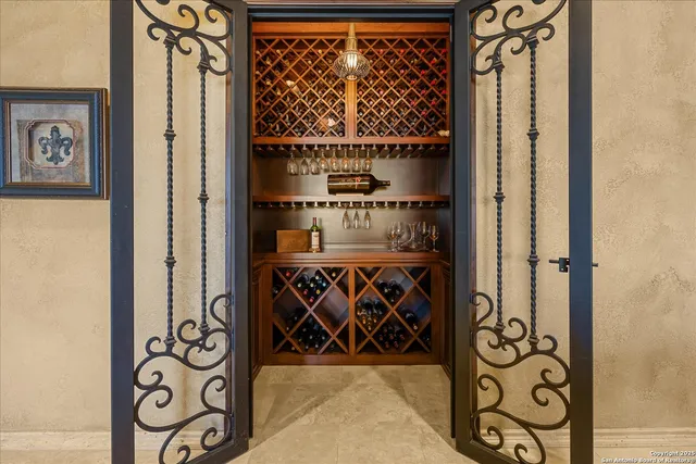 a kitchen with kitchen island granite countertop a stove and a sink