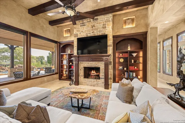 a kitchen with a stove a counter top space and stainless steel appliances