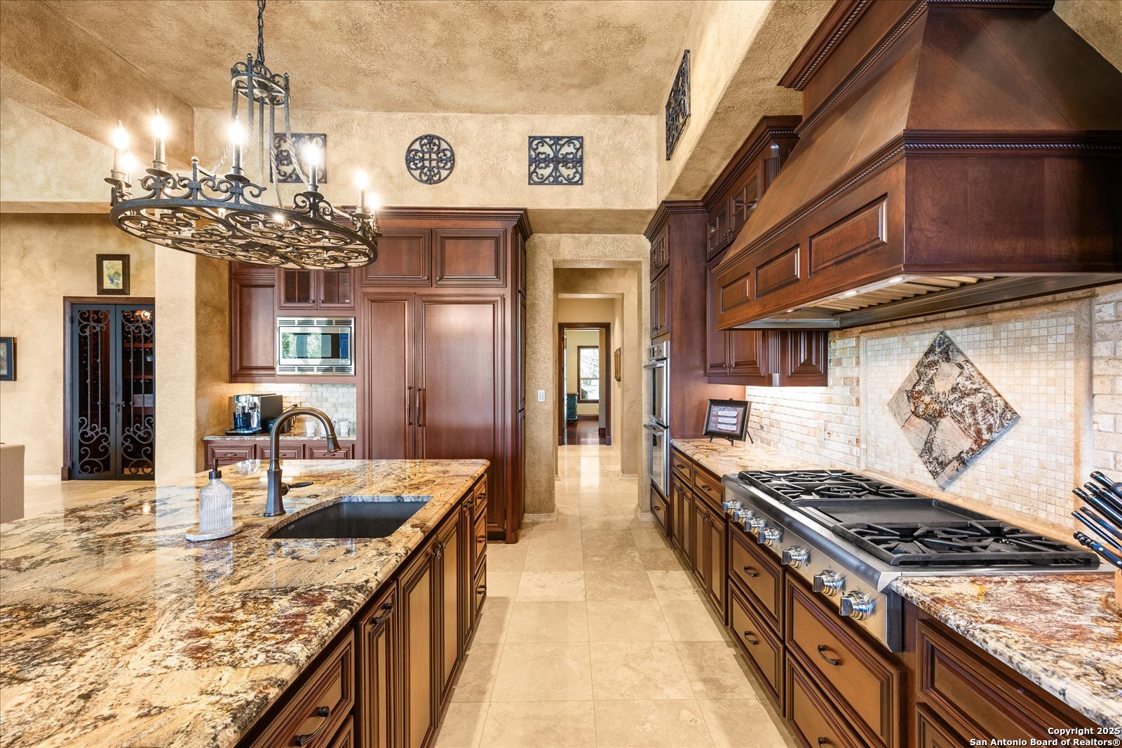 210 Rio Cordillera Boerne, TX 78006 - Photo 18 of 78 a kitchen with stainless steel appliances granite countertop a sink stove and refrigerator