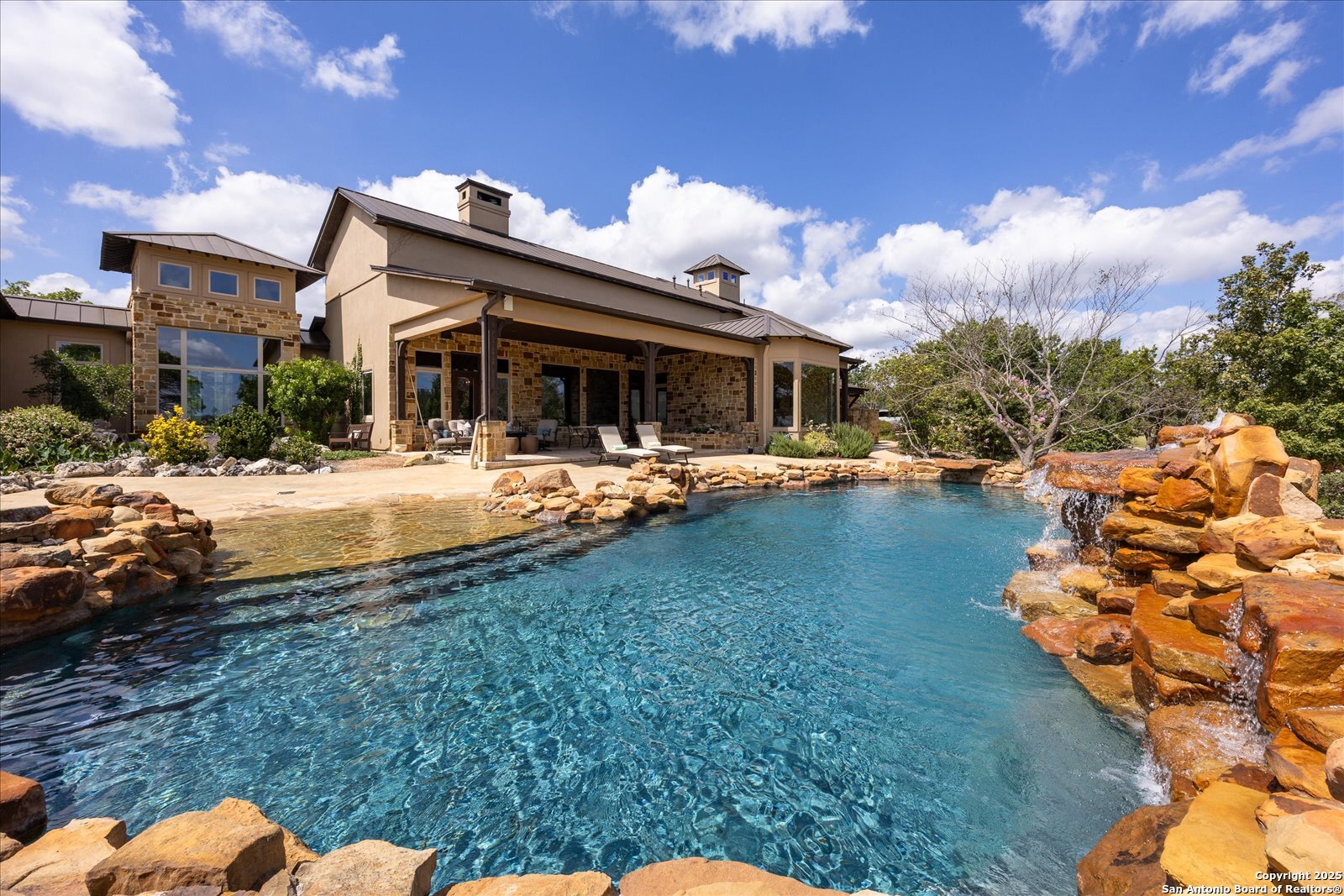210 Rio Cordillera Boerne, TX 78006 - Photo 2 of 78 a backyard of a house with table and chairs