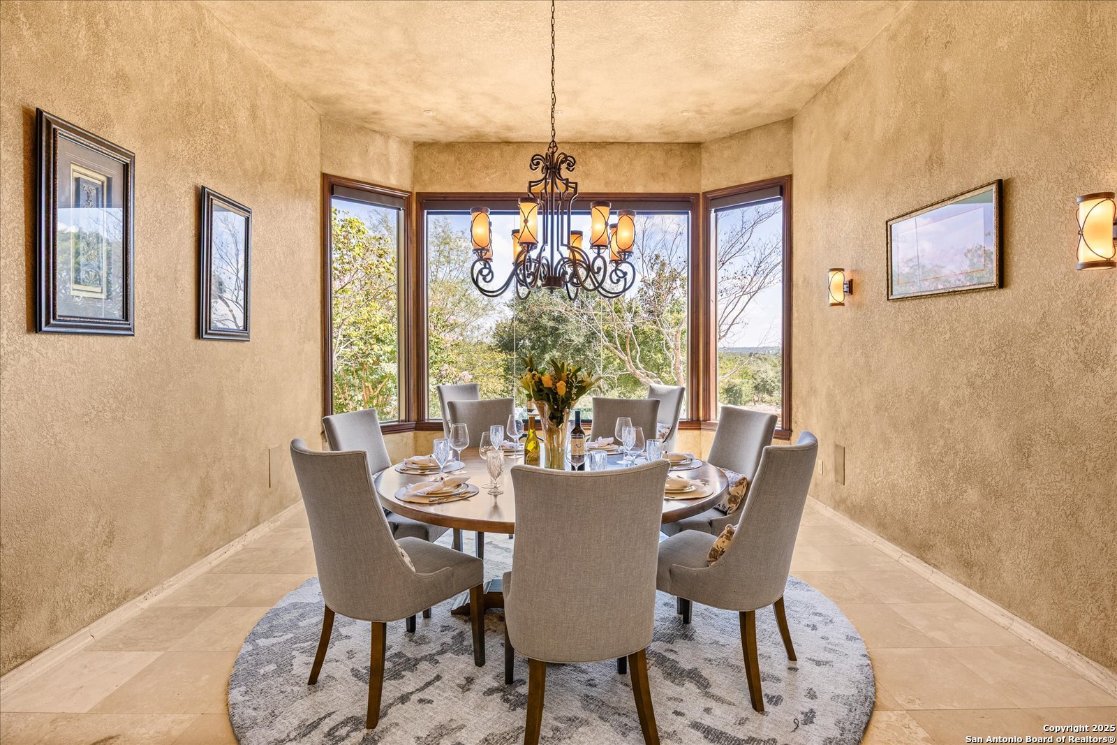 210 Rio Cordillera Boerne, TX 78006 - Photo 22 of 78 a view of a dining room with furniture wooden floor and a chandelier