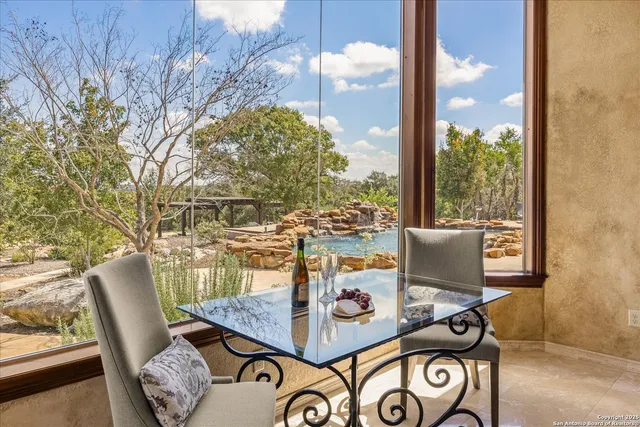 a kitchen with granite countertop a refrigerator and cabinets