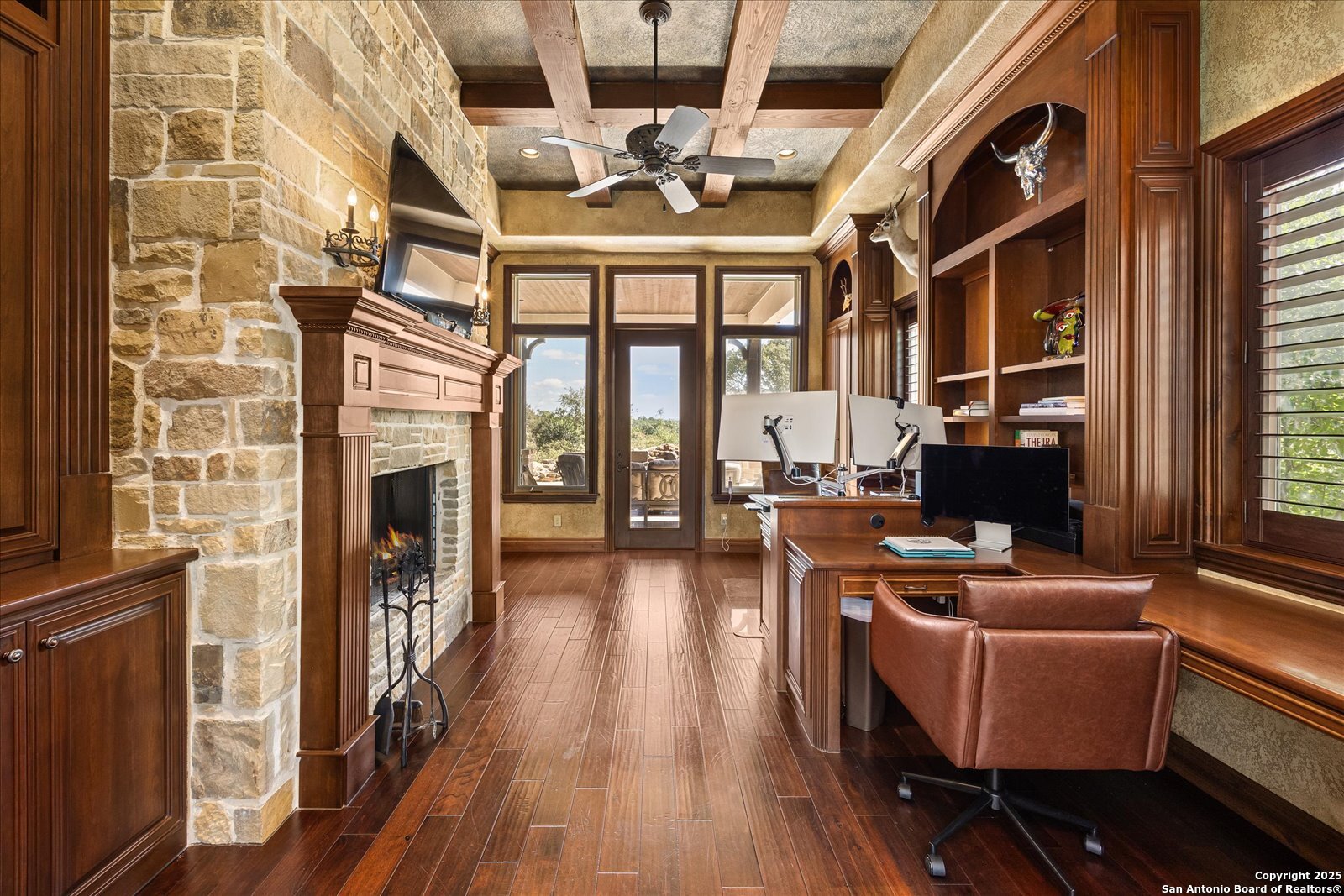 210 Rio Cordillera Boerne, TX 78006 - Photo 27 of 78 a living room with furniture a fireplace and a floor to ceiling window