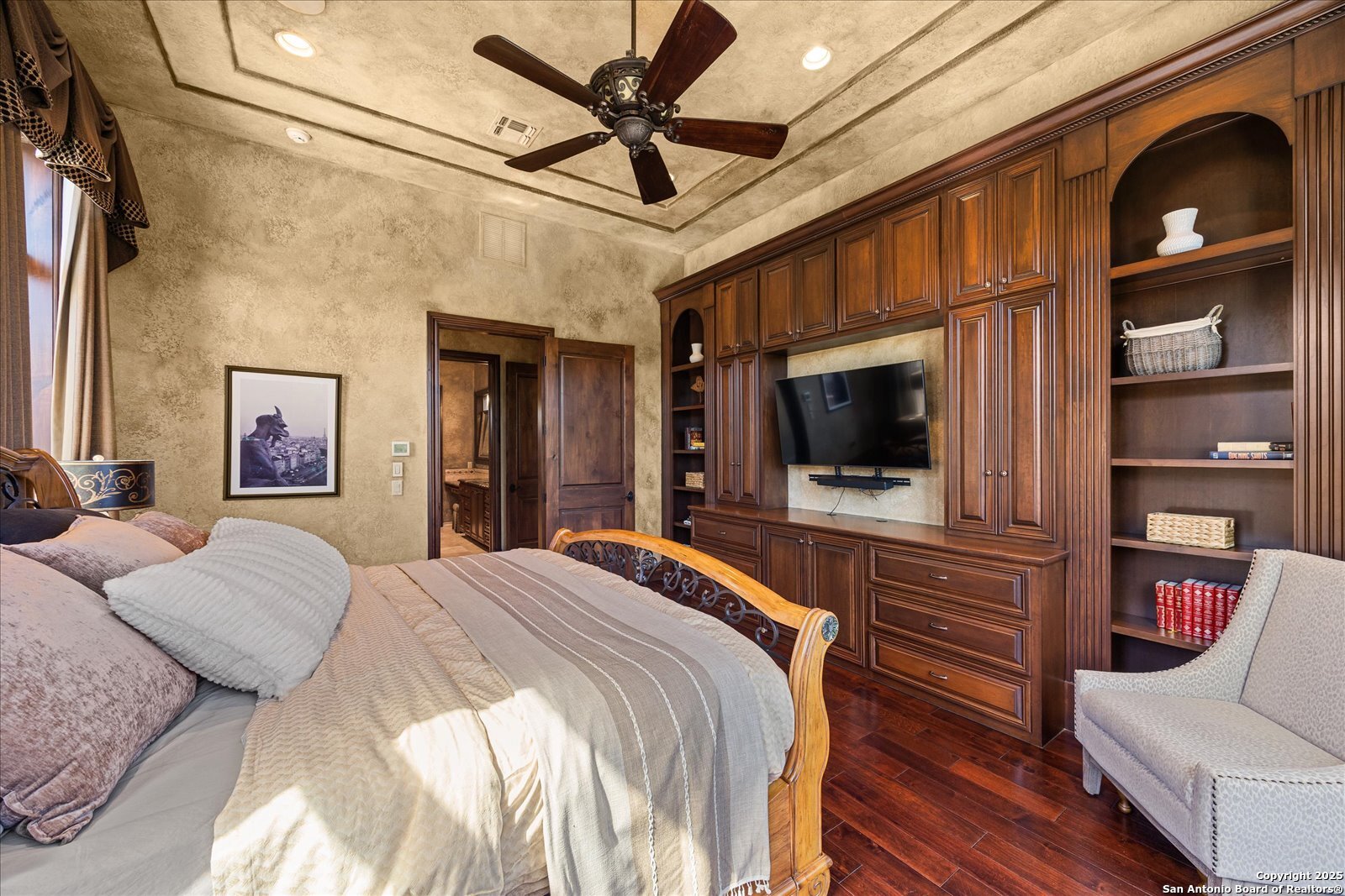 210 Rio Cordillera Boerne, TX 78006 - Photo 30 of 78 a bedroom with a bed and a flat screen tv