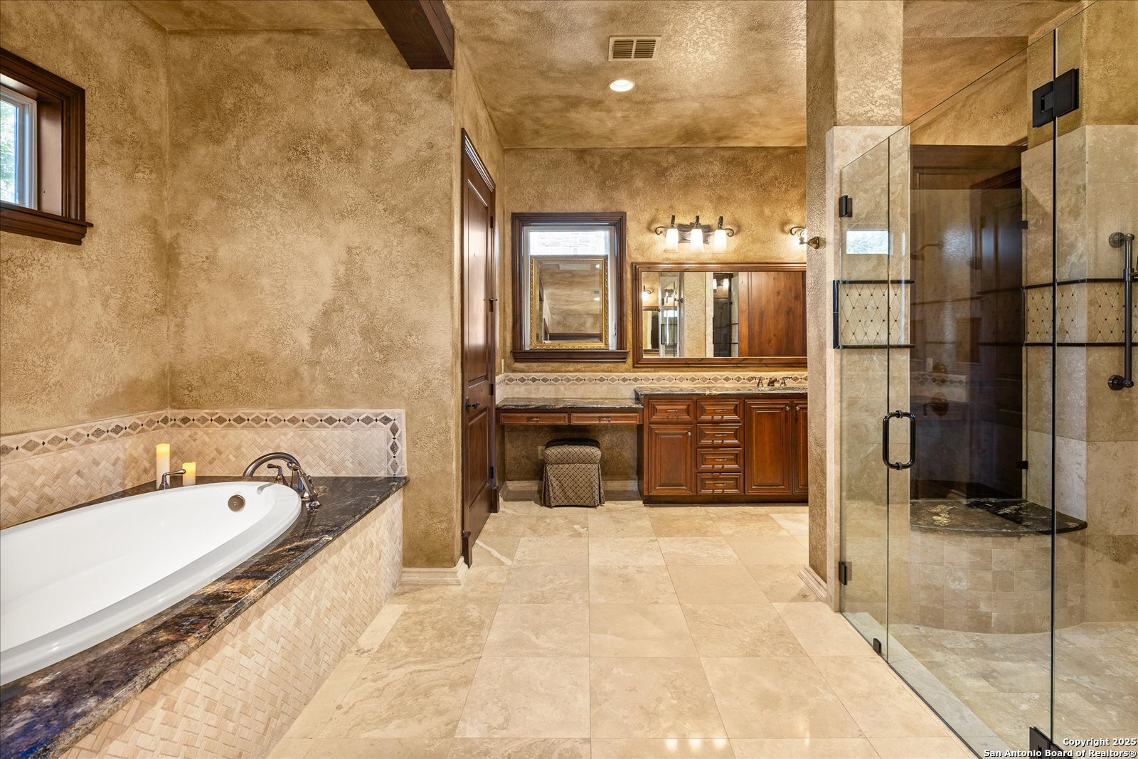 210 Rio Cordillera Boerne, TX 78006 - Photo 31 of 78 a bathroom with a tub a sink and a mirror