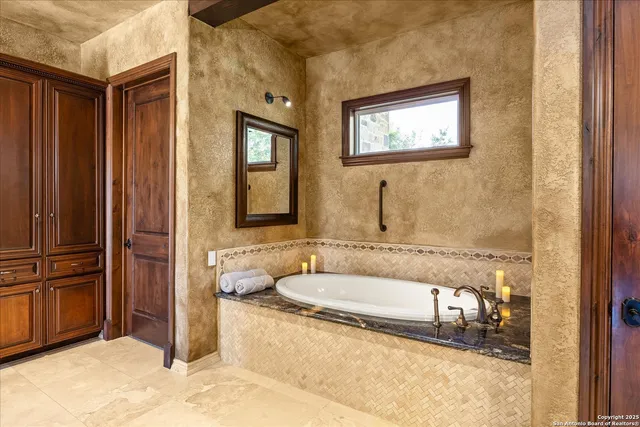 a bedroom with a bed wooden floor and window