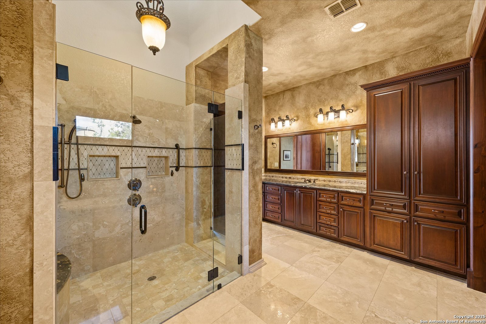 210 Rio Cordillera Boerne, TX 78006 - Photo 33 of 78 a kitchen with granite countertop a refrigerator and cabinets