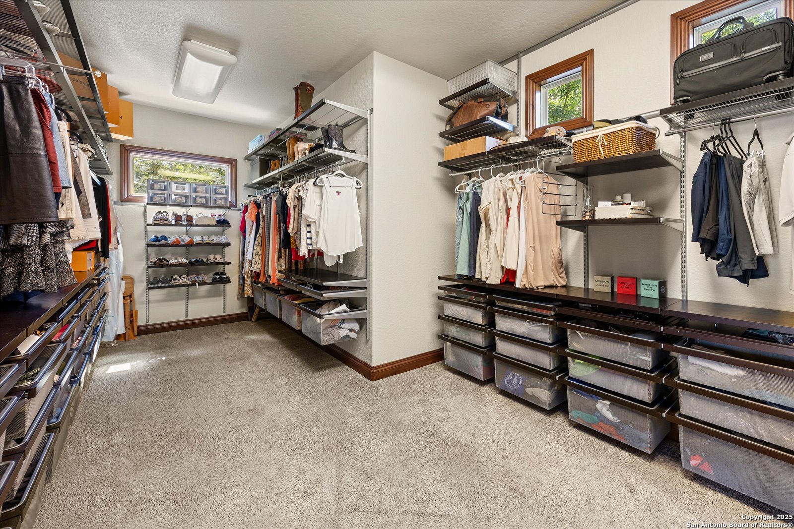 210 Rio Cordillera Boerne, TX 78006 - Photo 37 of 78 a view of walk in closet with clothes and shoes