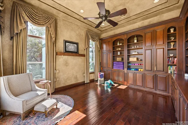 a bathroom with a granite countertop sink mirror and shower
