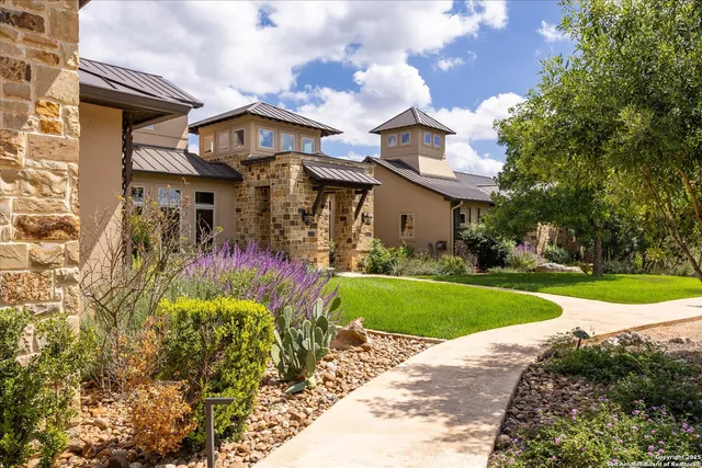 a front view of house and yard with green space