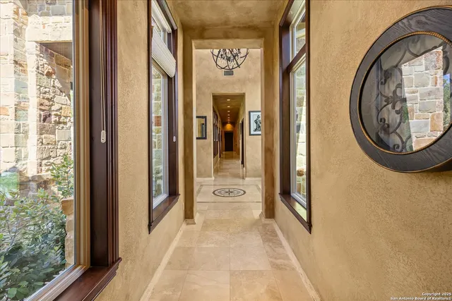 a view of a chair and tables in the patio