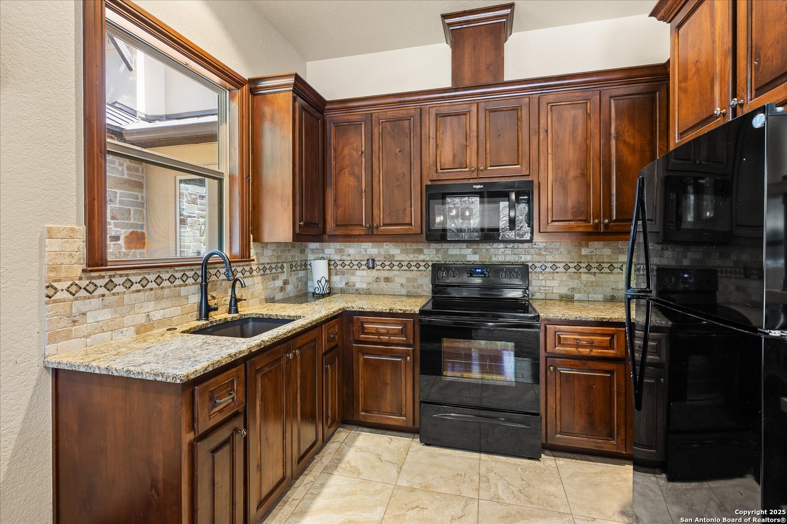 210 Rio Cordillera Boerne, TX 78006 - Photo 45 of 78 a kitchen with stainless steel appliances granite countertop a stove sink and cabinets