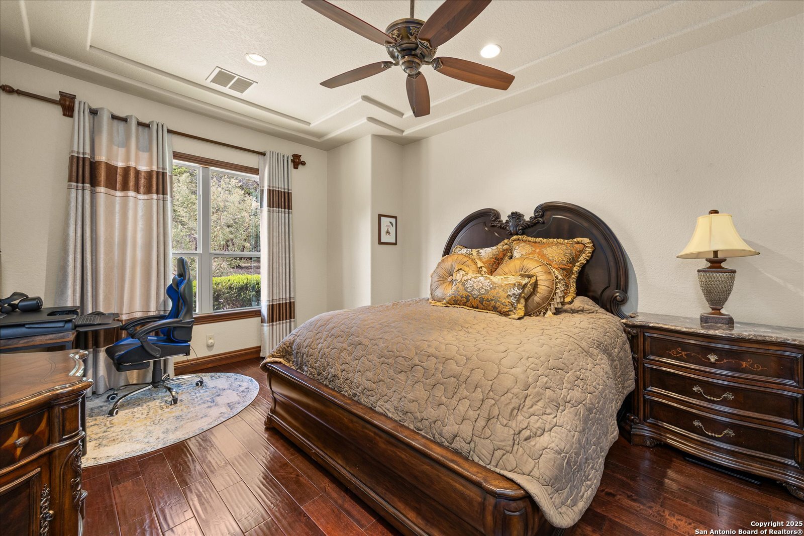 210 Rio Cordillera Boerne, TX 78006 - Photo 46 of 78 a bedroom with a bed wooden floor and window