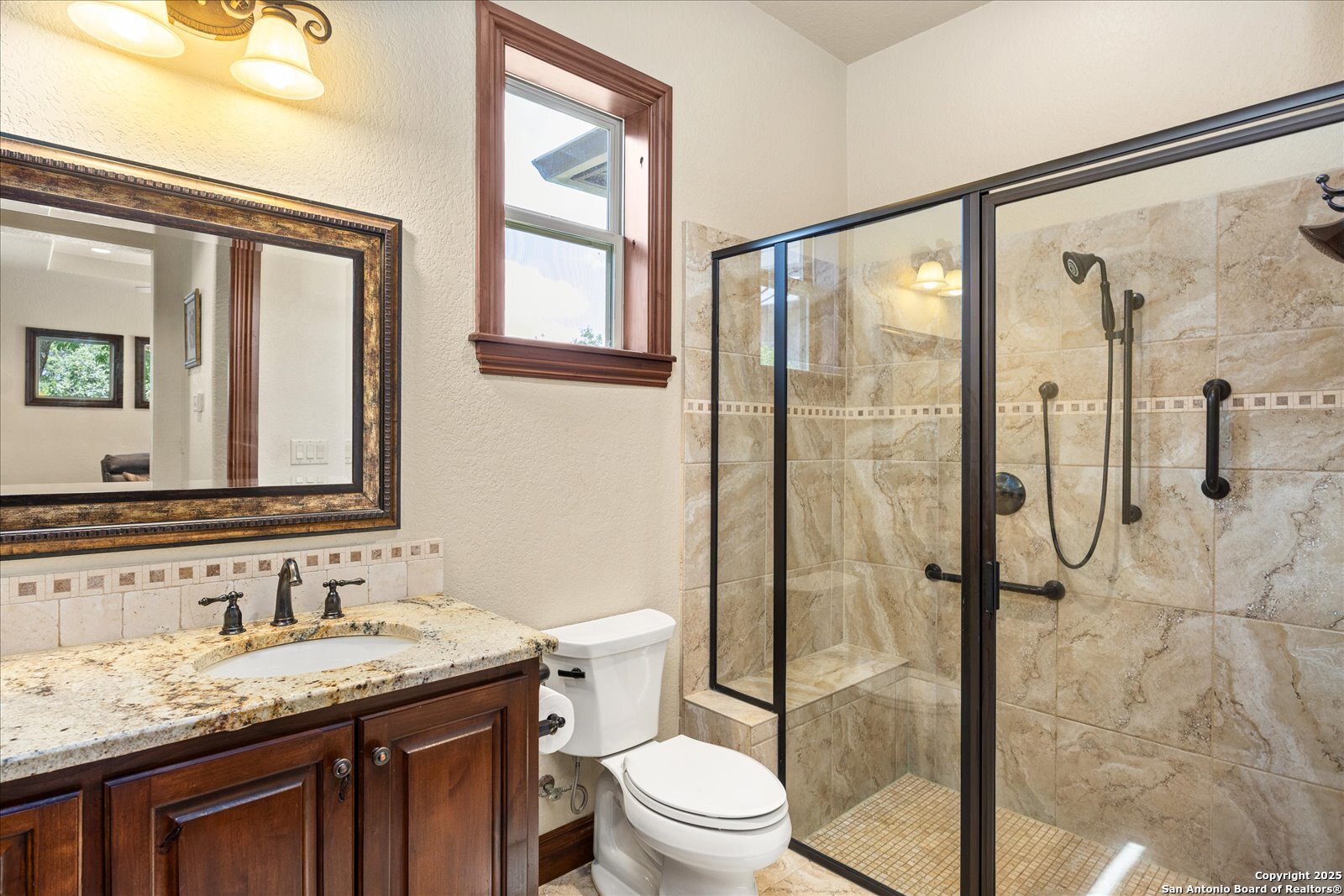 210 Rio Cordillera Boerne, TX 78006 - Photo 48 of 78 a bathroom with a granite countertop sink toilet and shower