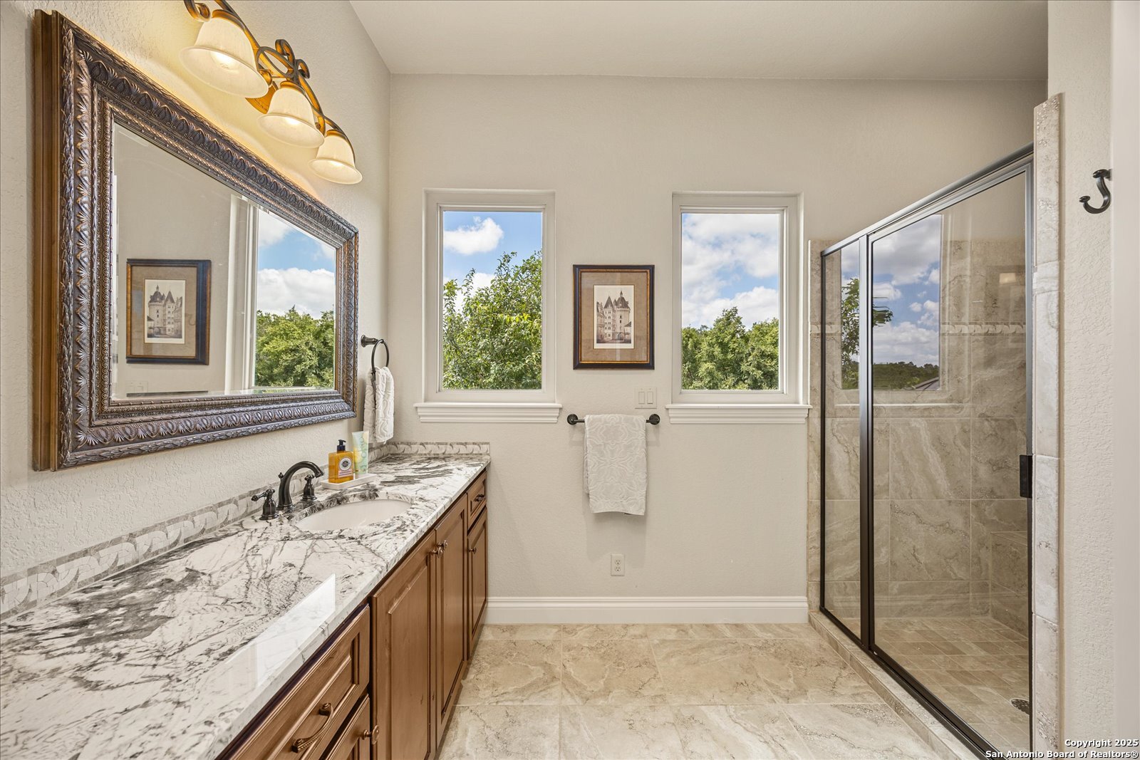 210 Rio Cordillera Boerne, TX 78006 - Photo 53 of 78 a bathroom with a granite countertop sink mirror and shower
