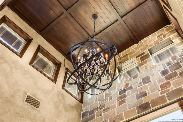 a living room with furniture and view of kitchen