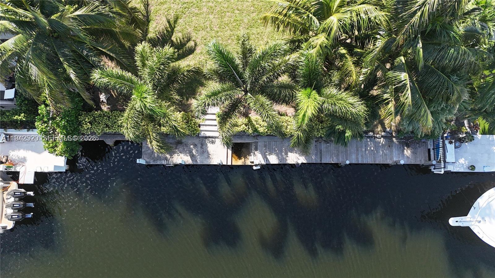 2511 Northeast 48th Court Lighthouse Point, FL 33064 - Photo 4 of 7 a view of a house with a yard