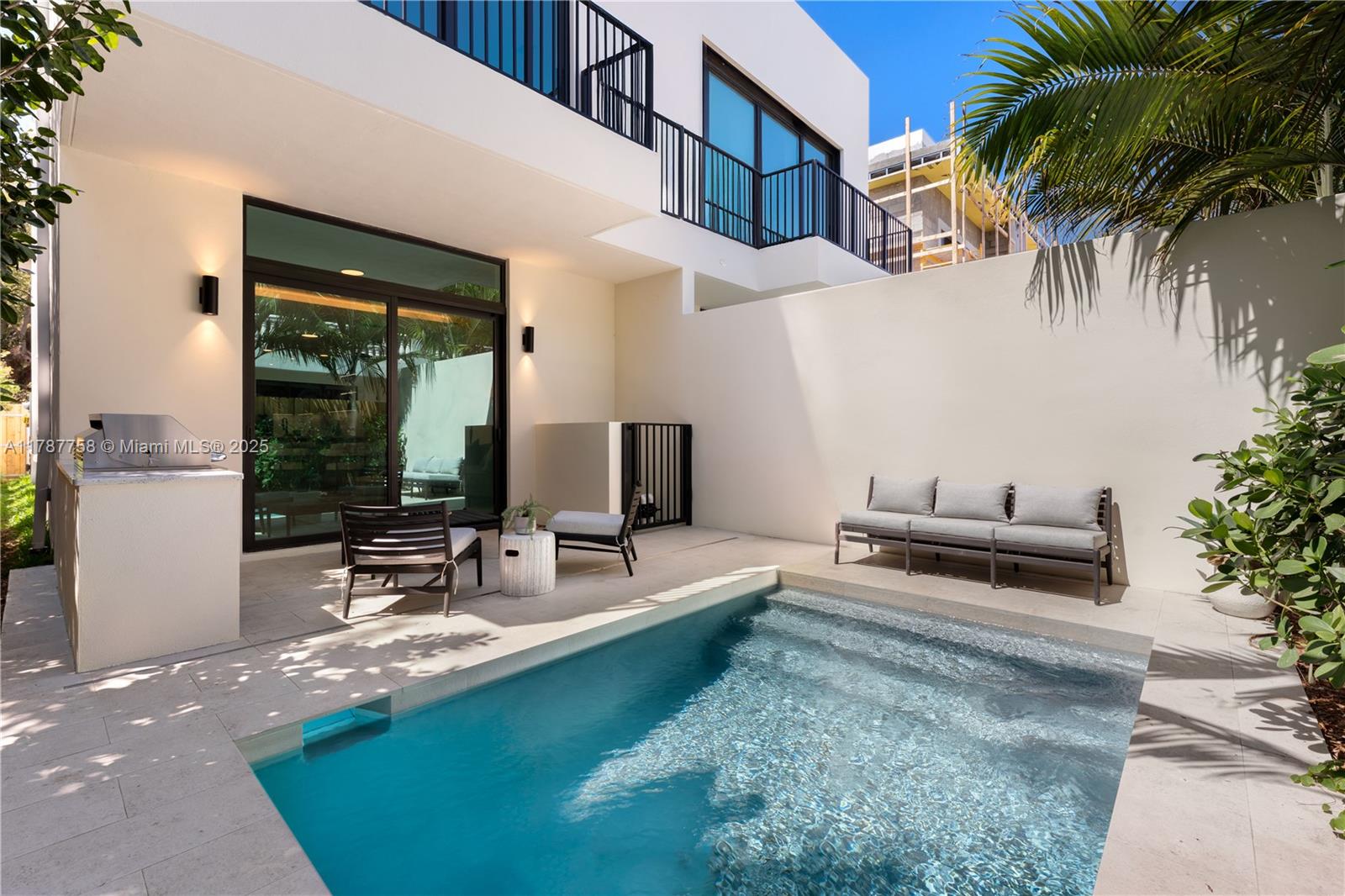 3073 Hibiscus Street, Unit 1 Miami, FL 33133 - Photo 11 of 27 a view of a house with backyard and sitting area