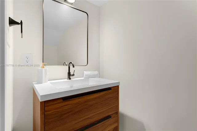 a close up of a sink and a mirror