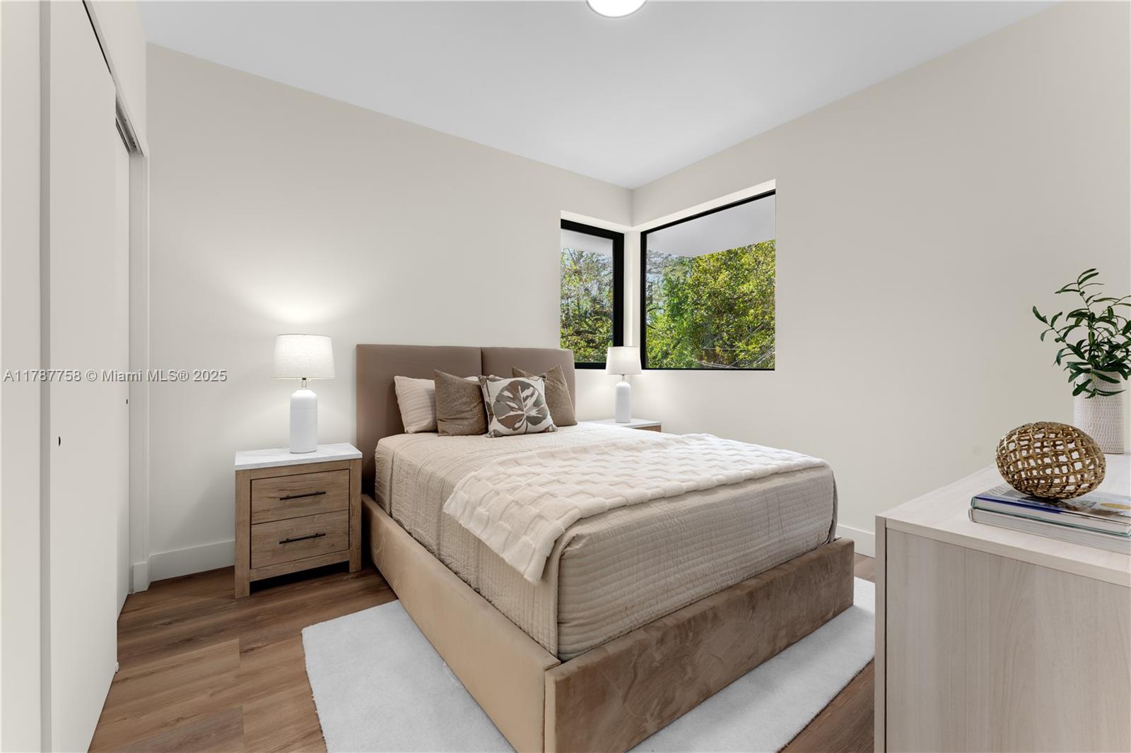 3073 Hibiscus Street, Unit 1 Miami, FL 33133 - Photo 22 of 27 a bedroom with a bed and a window