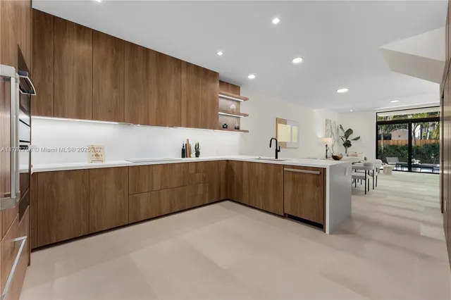 a kitchen with wooden cabinets