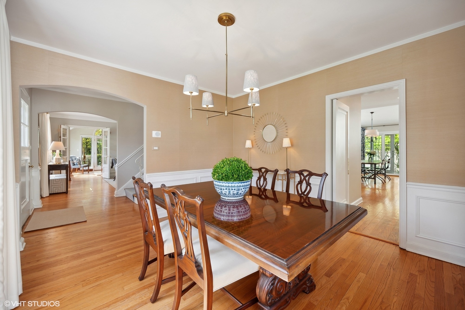 1744 Ridgewood Lane East Glenview, IL 60025 - Photo 11 of 48 a dining room with furniture potted plants and wooden floor