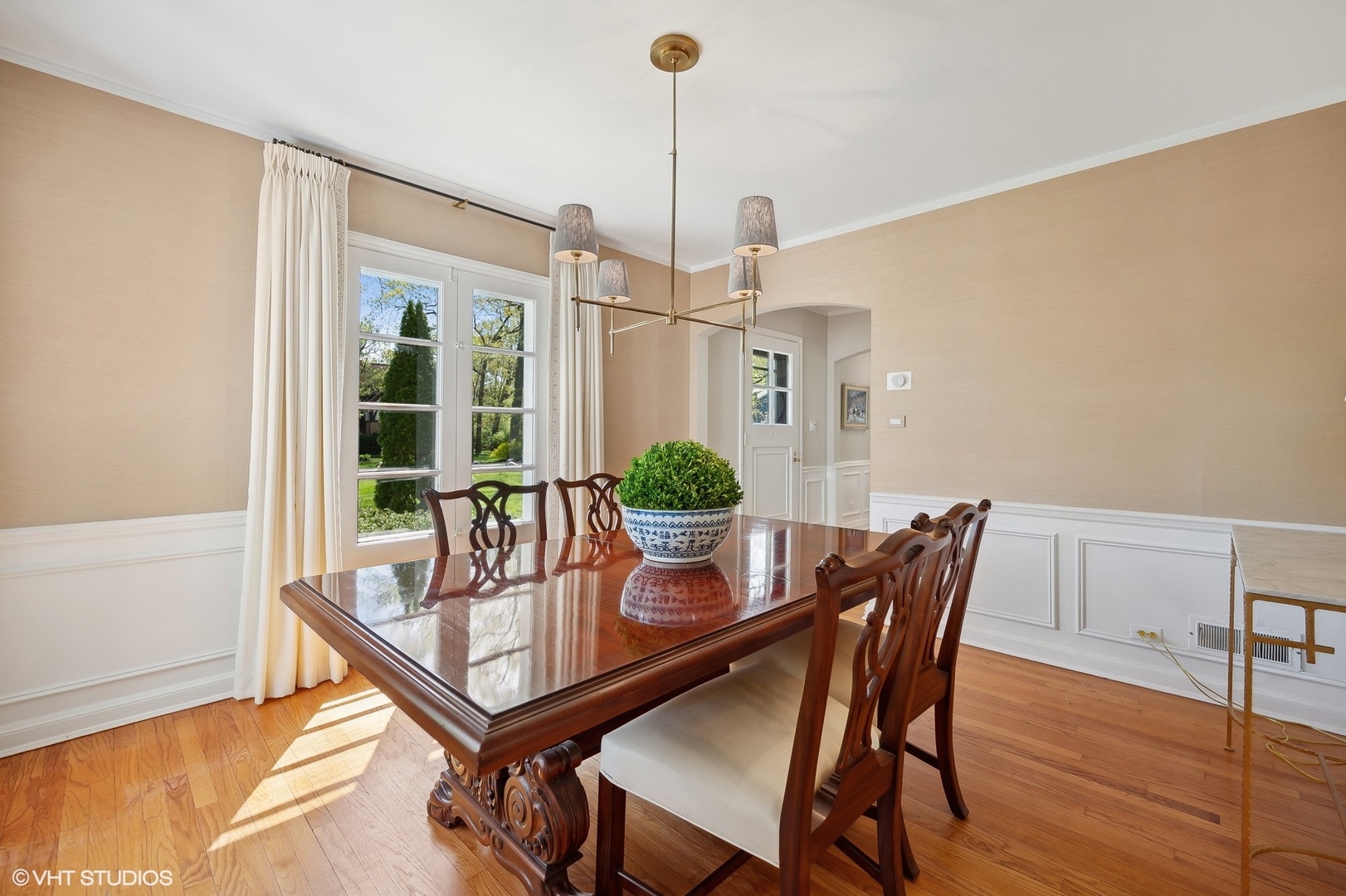 1744 Ridgewood Lane East Glenview, IL 60025 - Photo 12 of 48 a dining room with furniture a chandelier and wooden floor