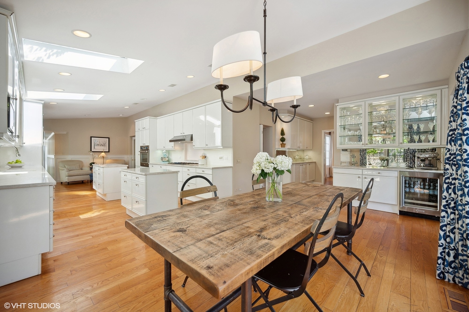 1744 Ridgewood Lane East Glenview, IL 60025 - Photo 16 of 48 a dining room filled chandelier and wooden furniture
