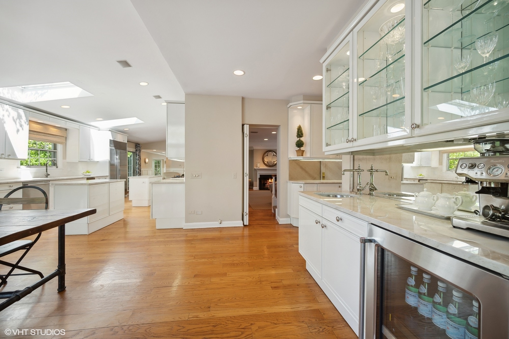 1744 Ridgewood Lane East Glenview, IL 60025 - Photo 17 of 48 a large kitchen with stainless steel appliances kitchen island granite countertop a large counter top and a stove top oven