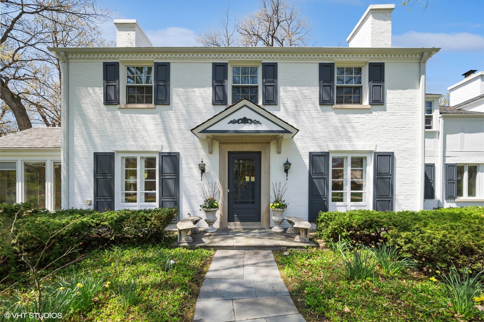 1744 Ridgewood Lane East Glenview, IL 60025 - Photo 2 of 48 front view of a brick house with a small yard