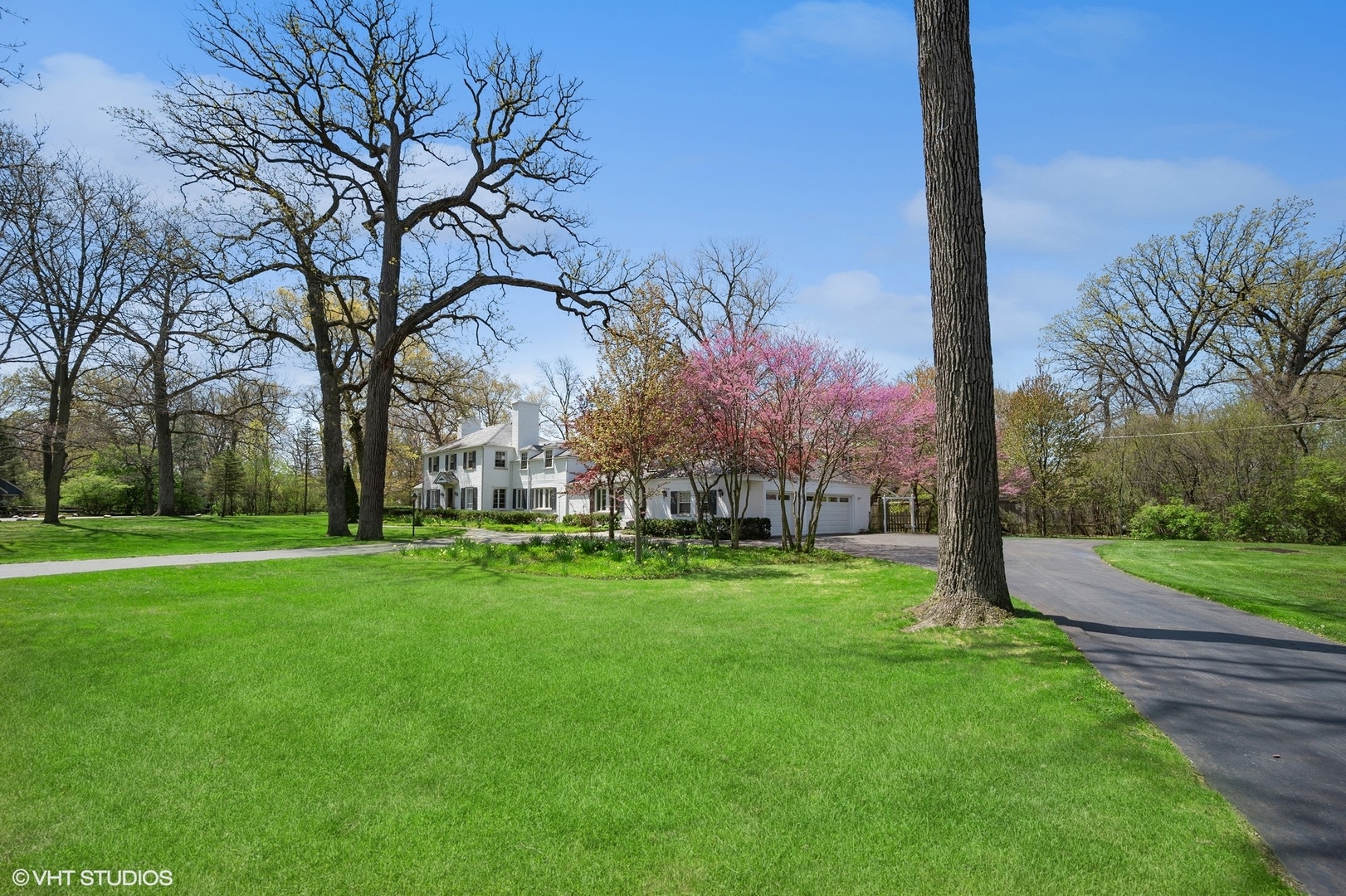 1744 Ridgewood Lane East Glenview, IL 60025 - Photo 21 of 48 a backyard of a house with lots of green space and fountain