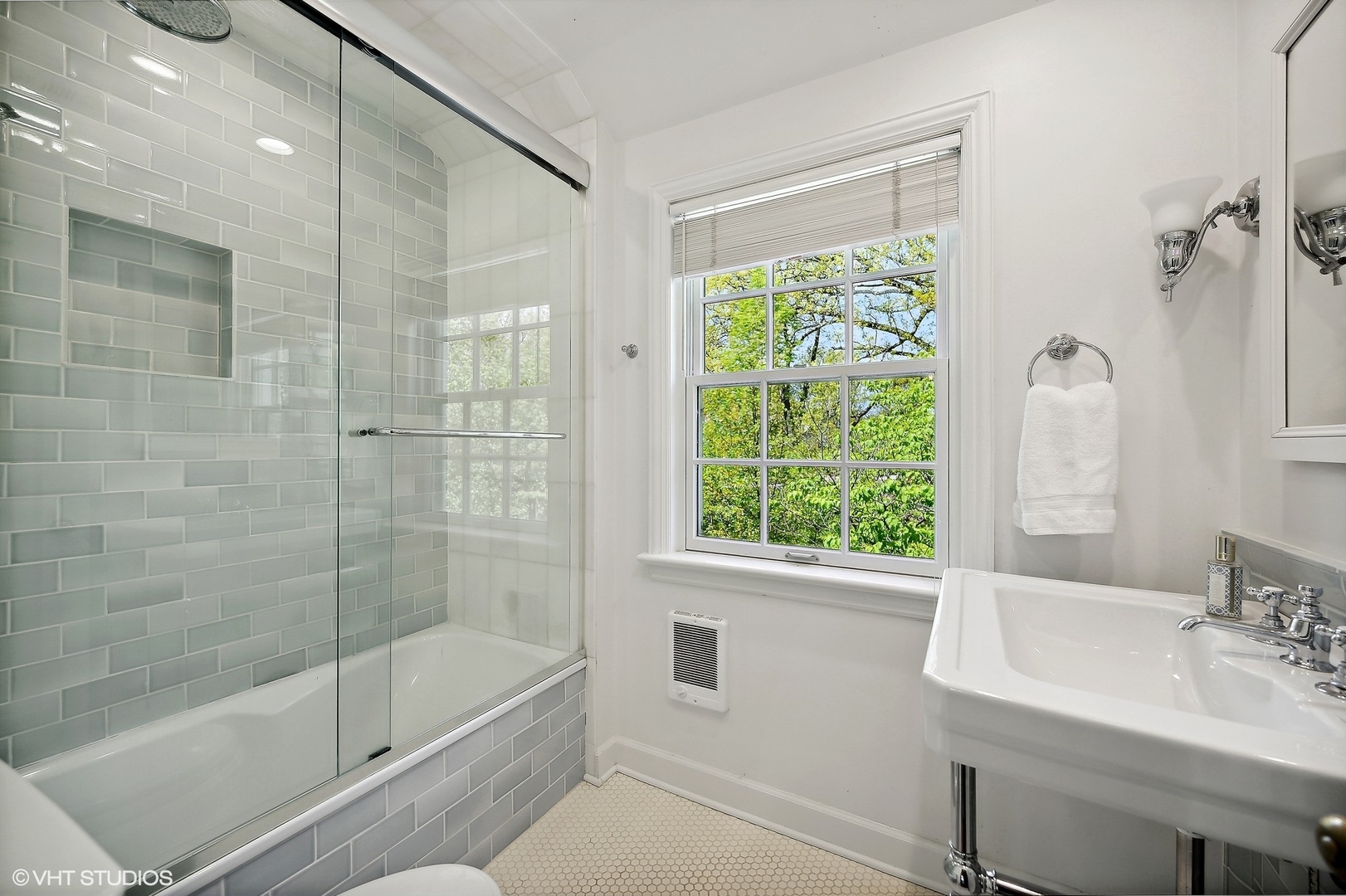 1744 Ridgewood Lane East Glenview, IL 60025 - Photo 36 of 48 a bathroom with a bathtub shower sink vanity and toilet