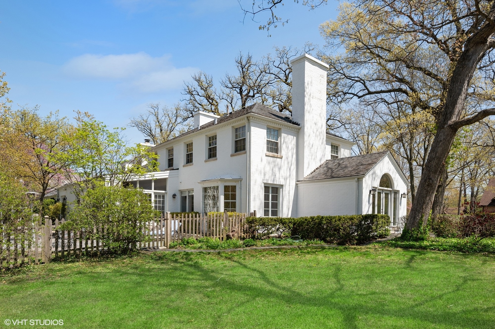 1744 Ridgewood Lane East Glenview, IL 60025 - Photo 38 of 48 a front view of a house with a garden