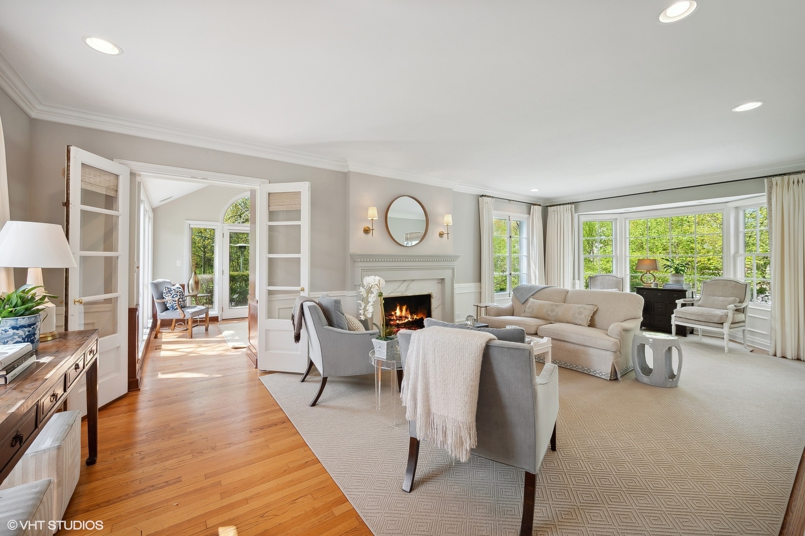 1744 Ridgewood Lane East Glenview, IL 60025 - Photo 5 of 48 a living room with fireplace furniture and a large window