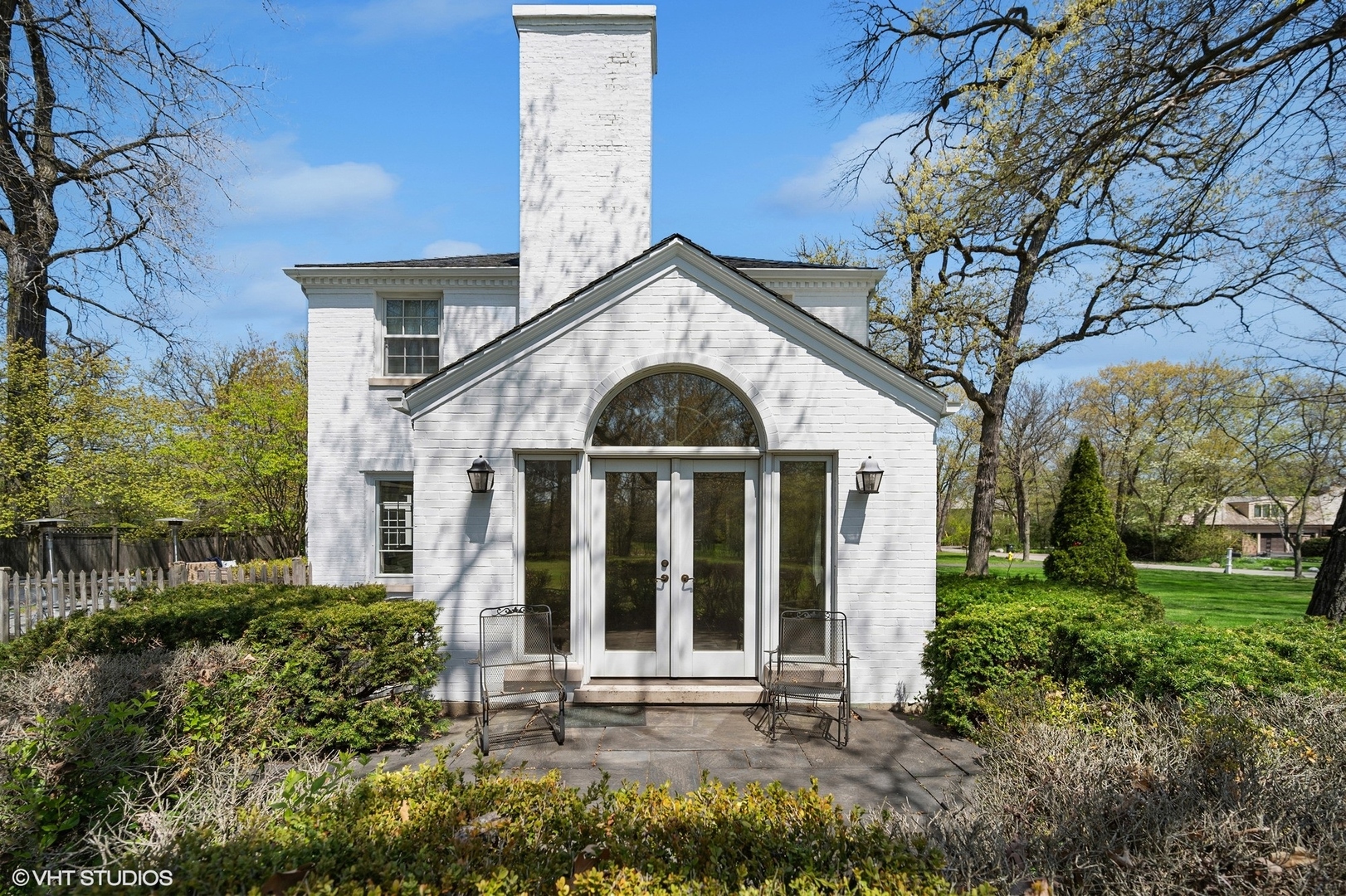 1744 Ridgewood Lane East Glenview, IL 60025 - Photo 10 of 48 a front view of a house with garden
