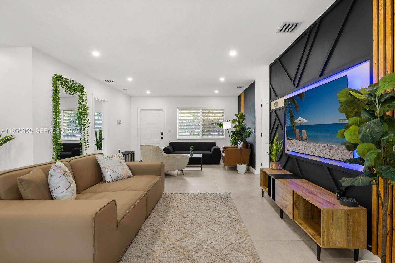 3260 Northwest 9th Street Miami, FL 33125 - Photo 17 of 33 a living room with furniture and a potted plant