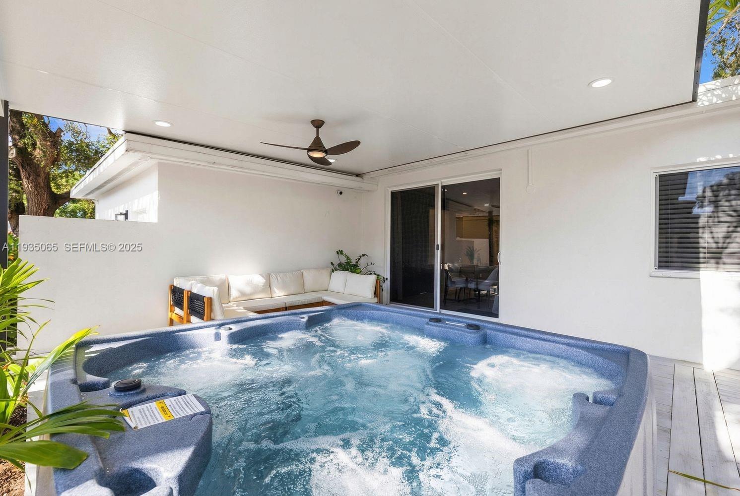 3260 Northwest 9th Street Miami, FL 33125 - Photo 29 of 33 a living room with furniture and a wooden floor
