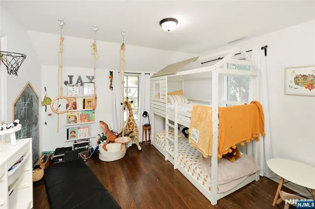 a view of a livingroom with furniture and a flat screen tv