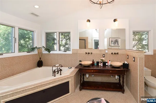a bathroom with a bathtub and a sink