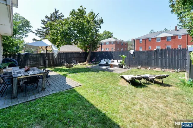a view of swimming pool with outdoor seating and a patio