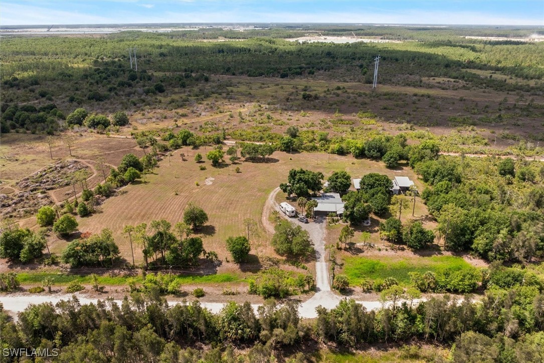 13951 Rod And Gun Club Road Fort Myers, FL 33913 - Photo 1 of 49 a view of a lake with beach and green space