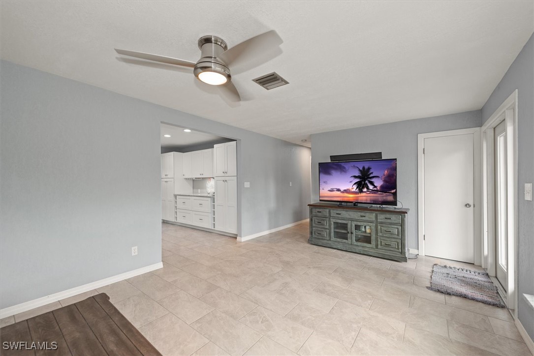 13951 Rod And Gun Club Road Fort Myers, FL 33913 - Photo 15 of 49 an empty room with furniture and painting on the wall
