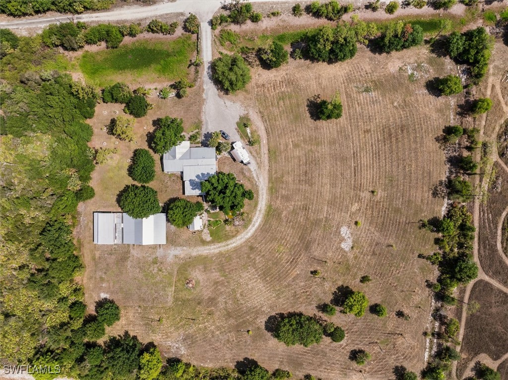 13951 Rod And Gun Club Road Fort Myers, FL 33913 - Photo 2 of 49 an aerial view of a house with a swimming pool