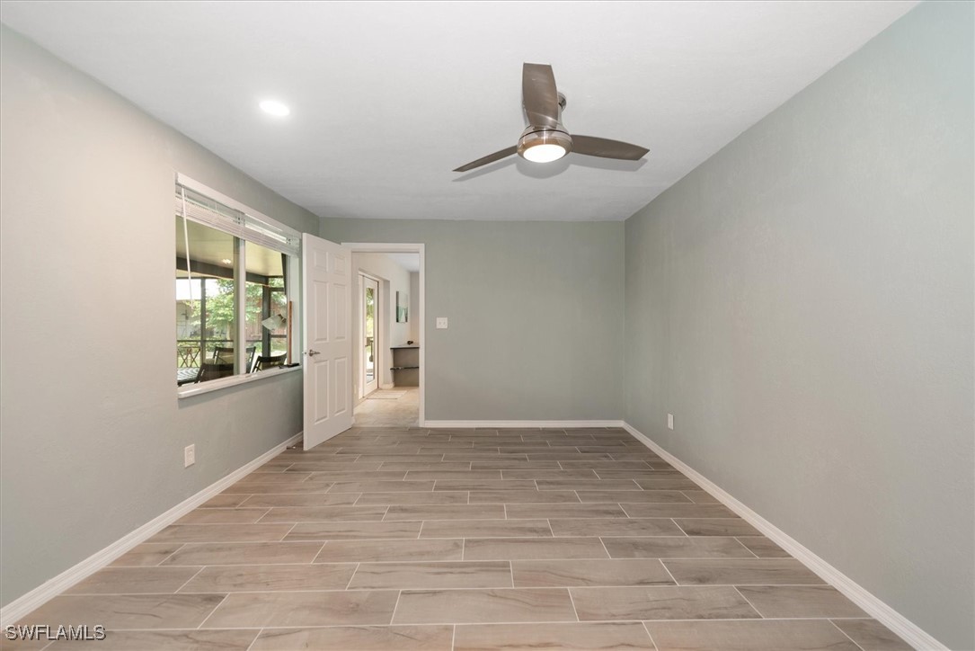 13951 Rod And Gun Club Road Fort Myers, FL 33913 - Photo 21 of 49 a view of an empty room with a window