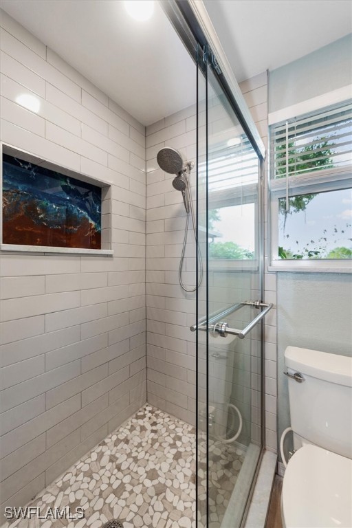 13951 Rod And Gun Club Road Fort Myers, FL 33913 - Photo 22 of 49 a bathroom with a toilet and a shower