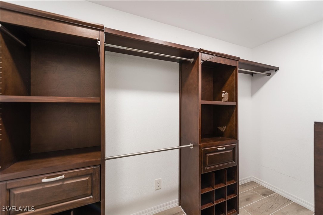 13951 Rod And Gun Club Road Fort Myers, FL 33913 - Photo 32 of 49 a view of walk in closet with empty racks