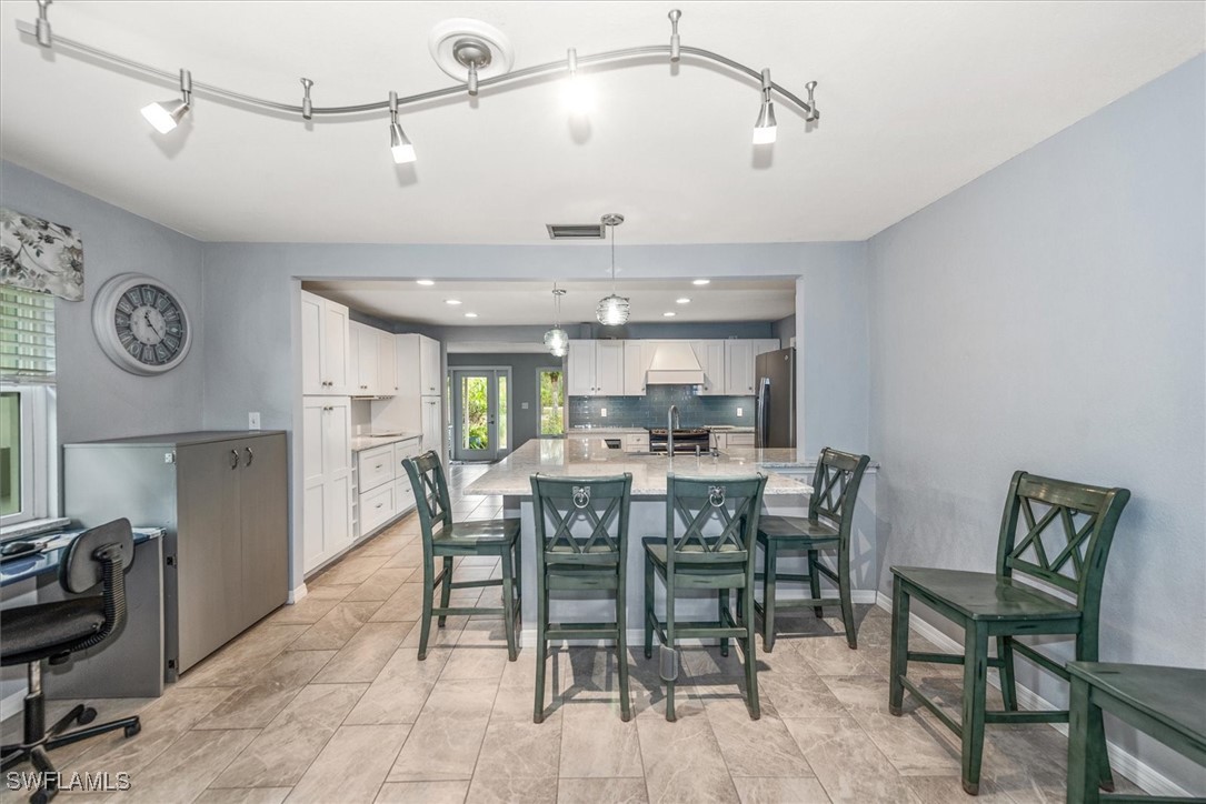 13951 Rod And Gun Club Road Fort Myers, FL 33913 - Photo 33 of 49 a view of a dining room with furniture